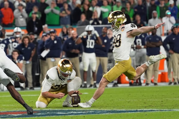 Notre Dame place kicker Mitch Jeter (98) kicks the game winning field goal during the second half of the Orange Bowl College Football Playoff semifinal game against Penn State Thursday, Jan. 9, 2025, in Miami Gardens, Fla. (AP Photo/Rebecca Blackwell)