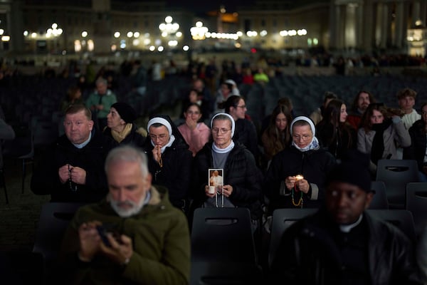 Catholic nuns attend a nightly rosary prayer service for Pope Francis in St. Peter's Square at the Vatican, Thursday, March 6, 2025. (AP Photo/Francisco Seco)