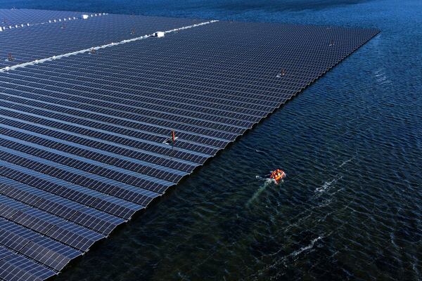 FILE - A floating solar farm operates on the Cottbuser Ostsee lake near Cottbus, Germany, Oct. 16, 2024. (AP Photo/Matthias Schrader, File)