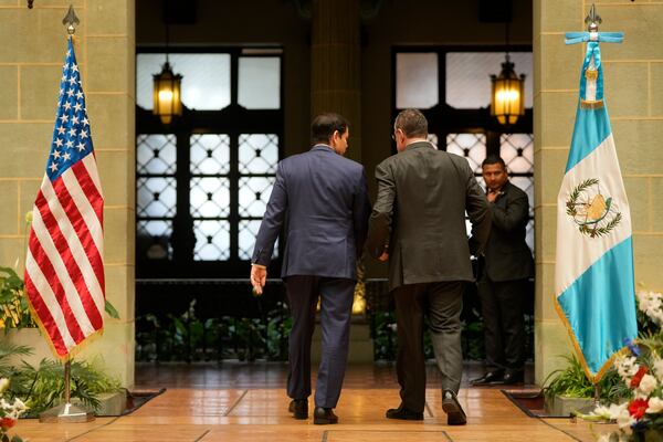 U.S. Secretary of State Marco Rubio, left, and Guatemalan President Bernardo Arevalo walk away after giving a joint news conference at the National Palace in Guatemala City, Wednesday, Feb. 5, 2025. (AP Photo/Mark Schiefelbein, Pool)