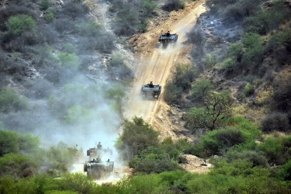 In this photo released by the Inter Services Public Relations, Army tanks roll down during a military exercises in Tilla Field Firing Range, in the Jhelum district, Pakistan, Thursday, May 1, 2025. (Inter Services Public Relations via AP)