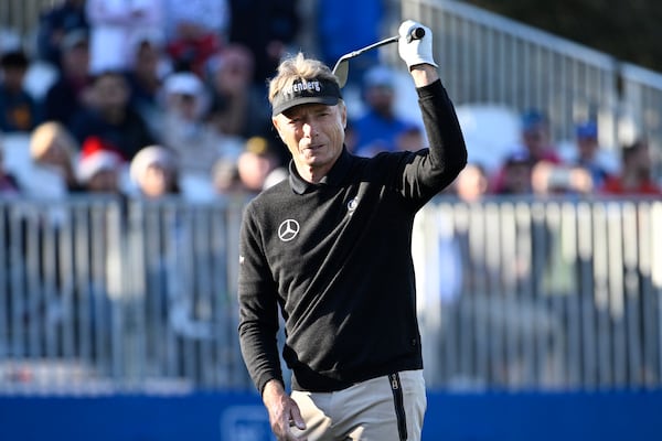 Bernhard Langer reacts after chipping onto the 18th green during the first round of the PNC Championship golf tournament, Saturday, Dec. 21, 2024 in Orlando. (AP Photo/Phelan M. Ebenhack)