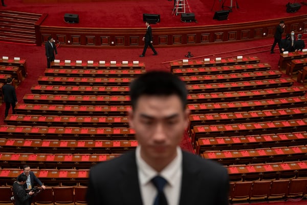 Documents are laid out for delegates before the closing ceremony of the National People's Congress held at the Great Hall of the People in Beijing, Tuesday, March 11, 2025. (AP Photo/Ng Han Guan)