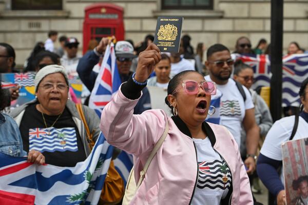 People demonstrate outside the Foreign Office in London, Thursday, May 22, 2025, after a British court blocked the U.K. from transferring sovereignty over the Chagos Islands to Mauritius hours before the agreement was due to be signed. (AP Photo/Thomas Krych)