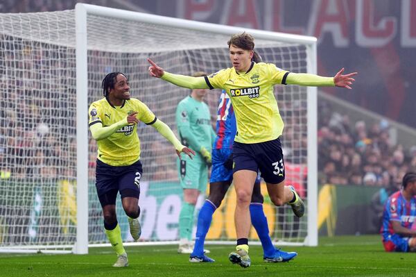 Southampton's Tyler Dibling, right, celebrates after scoring the opening goal during the English Premier League soccer match between Crystal Palace and Southampton at Selhurst Park, London, Sunday, Dec. 29, 2024. (Adam Davy/PA via AP)