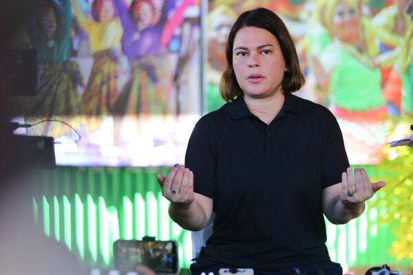 Philippine Vice President Sara Duterte gestures as she speaks to the media during a press conference after casting her vote at a polling center in Davao City, southern Philippines, Monday, May 12, 2025. (AP Photo/Manman Dejeto)