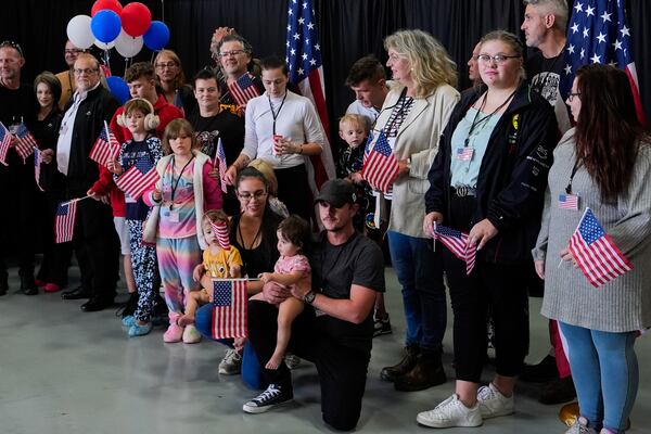 Afrikaner refugees from South Africa arrive, Monday, May 12, 2025, at Dulles International Airport in Dulles, Va. (AP Photo/Julia Demaree Nikhinson)