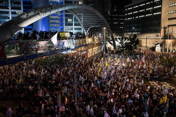 People take part in a protest demanding the immediate release of hostages held by Hamas in the Gaza Strip, in Tel Aviv, Israel, Saturday, March 15, 2025. (AP Photo//Oded Balilty)