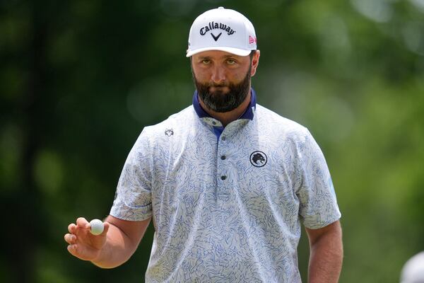 Jon Rahm, of Spain, waves after making a putt on the first hole during the third round of the PGA Championship golf tournament at the Quail Hollow Club, Saturday, May 17, 2025, in Charlotte, N.C. (AP Photo/George Walker IV)