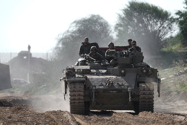 Israeli troops are crossing into Israel from the Gaza Strip, Saturday, Jan. 18, 2025. (AP Photo/Tsafrir Abayov)