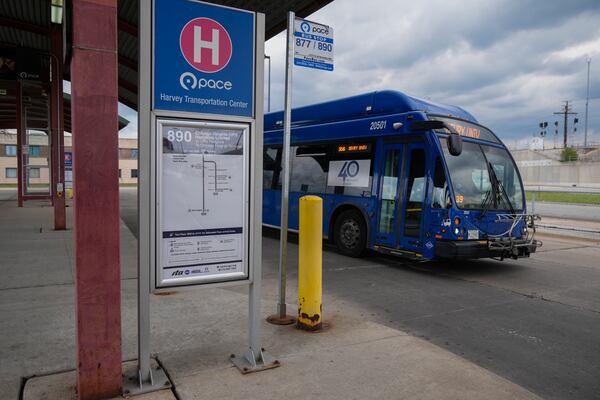 A bus leaves the Pace Harvey Transportation Center, Thursday, May 29, 2025, in Harvey, Ill. (AP Photo/Erin Hooley)