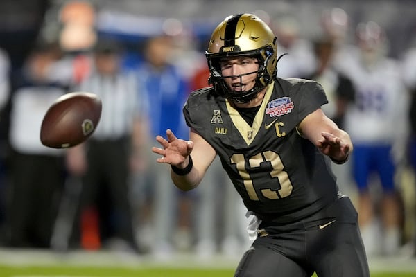 Army quarterback Bryson Daily (13) pitches the ball to a teammate during the first half of the Independence Bowl NCAA college football game against Louisiana Tech, Saturday, Dec. 28, 2024, in Shreveport, La. (AP Photo/Rogelio V. Solis)