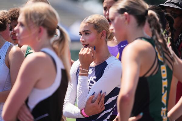 AB Hernandez, center, joins other athletes for a briefing before the high jump competition at the California high school track-and-field championships in Clovis, Calif., Friday, May 30, 2025. (AP Photo/Jae C. Hong)
