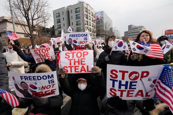 Supporters of impeached South Korean President Yoon Suk Yeol attend a rally to oppose his impeachment near the presidential residence in Seoul, South Korea, Wednesday, Jan. 8, 2025. (AP Photo/Ahn Young-joon)