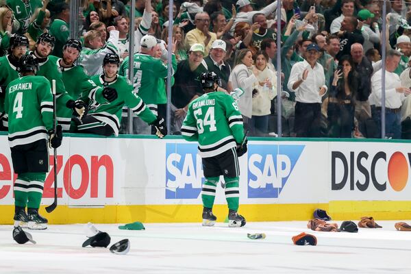 Dallas Stars center Mikael Granlund (64) celebrates with the Stars bench after earning a hat trick in the third period of Game 4 of a second-round NHL hockey playoff series in Dallas, Tuesday, May 13, 2025. (AP Photo/Gareth Patterson)