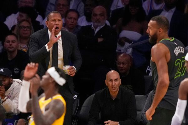 Minnesota Timberwolves co-owner Alex Rodriguez yells to center Rudy Gobert after he scored during the second half in Game 5 of an NBA basketball first-round playoff series against the Los Angeles Lakers, Wednesday, April 30, 2025, in Los Angeles. (AP Photo/Mark J. Terrill)