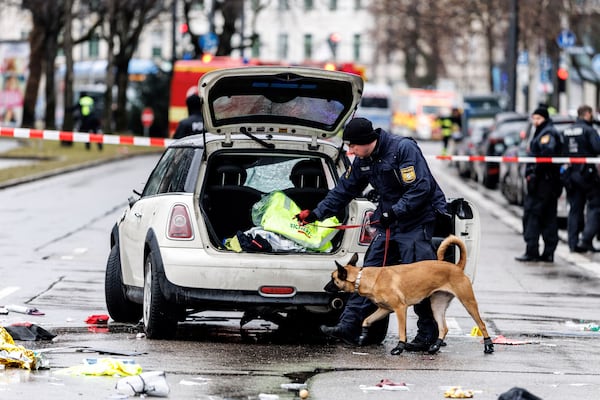 Emergency services attend the scene of an accident after a driver hit a group of people in Munich, Germany, Thursday Feb. 13, 2025. (Matthias Balk/dpa via AP)