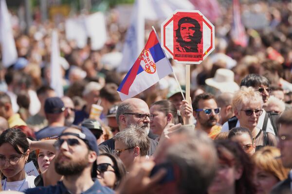University students and people protest in front of the government building, six months after the deadly train station tragedy that sparked mass demonstrations against corruption, in Belgrade, Serbia, Thursday, May 1, 2025. (AP Photo/Darko Vojinovic)