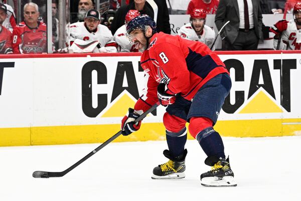 Washington Capitals left wing Alex Ovechkin (8) skates with the puck in the first period of Game 5 of a second-round NHL hockey playoff series against the Carolina Hurricanes Thursday, May 15, 2025, in Washington. (AP Photo/Nick Wass)