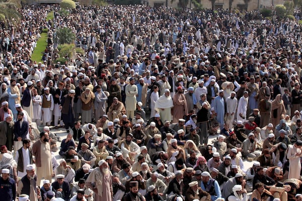 Mourners attend the funeral prayer of a senior Muslim cleric, Hamidul Haq who was killed in the Friday's suicide bomb attack at a pro-Taliban seminary in Akora Khattak, Pakistan, Saturday, March 1, 2025. (AP Photo/Muhammad Sajjad)