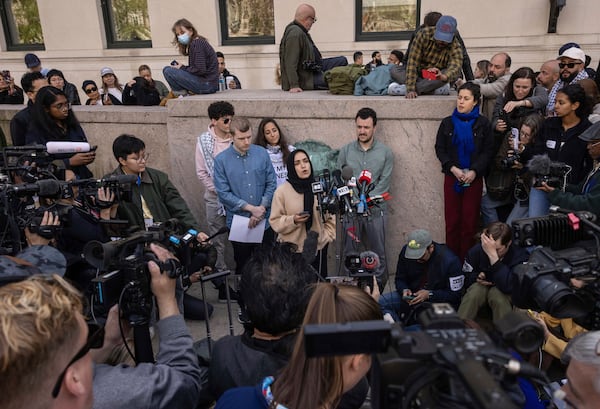 FILE - Mahmoud Khalil, center right, listens as members of the student protest negotiation team speak during a press conference near the pro-Palestinian demonstration encampment at the Columbia University, Friday, April 26, 2024, in New York. (AP Photo/Yuki Iwamura, File)