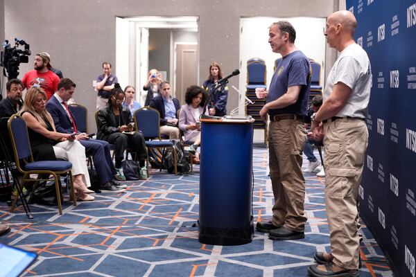 National Transportation Safety Board lead investigator Brian Young, second from right, and board member Michael Graham, right, take questions from reporters during a news conference in New York, Monday, May 19, 2025. (AP Photo/Seth Wenig)