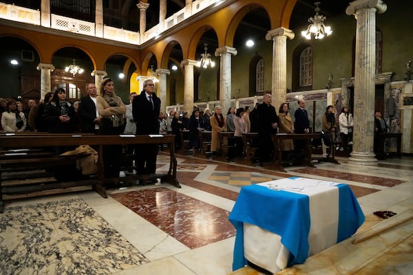 Faithful attend a thanksgiving mass on the 12th anniversary of Pope Francis election at the Argentinean's church in Rome, Thursday, March 13, 2025. (AP Photo/Gregorio Borgia)