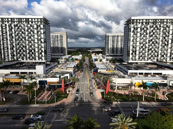 FILE - Cars pass through the area known as Downtown Doral, April 5, 2025, in Doral, Fla. (AP Photo/Rebecca Blackwell, File)