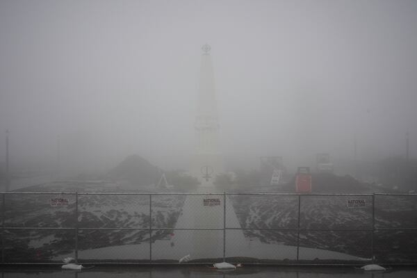 Fog covers the landscape during a rainstorm at the Griffith Park Observatory Thursday, Feb. 13, 2025, in Los Angeles. (AP Photo/Damian Dovarganes)