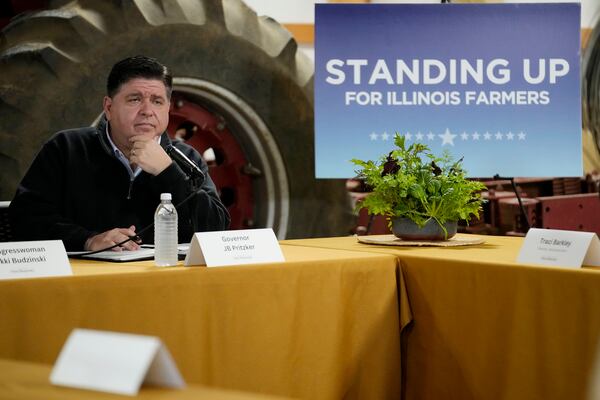 Illinois Gov. JB Pritzker listens to a question during a roundtable discussion on impacts of the Trump Administration's actions on climate-smart agriculture and local farm economy at Sola Gratia Farm in Urbana, Ill., Wednesday, March 19, 2025. (AP Photo/Nam Y. Huh)