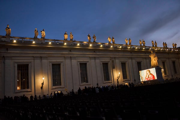 People attend a Rosary prayer for Pope Francis, in St. Peter's Square at the Vatican, Tuesday, March 11, 2025. (AP Photo/Francisco Seco)