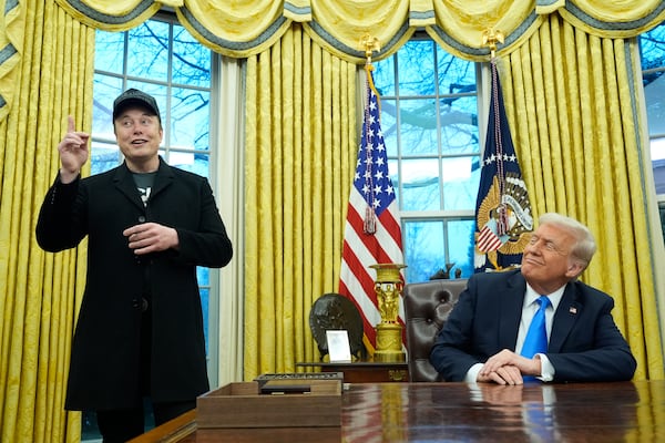 FILE - President Donald Trump listens as Elon Musk speaks in the Oval Office at the White House, Tuesday, Feb. 11, 2025, in Washington. (AP Photo/Alex Brandon, File)