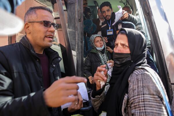 Palestinians wounded in the Israeli bombardment of the Gaza Strip wait before crossing the Rafah border into Egypt, as wounded and sick Palestinians are allowed to leave the Gaza Strip for medical treatment, in Khan Younis, Saturday, Feb. 1, 2025. (AP Photo/Jehad Alshrafi)