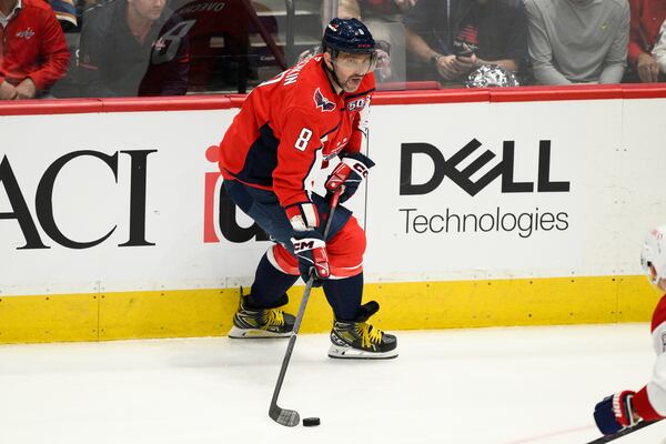 Washington Capitals left wing Alex Ovechkin (8) skates with the puck in the third period of Game 2 of a first-round NHL hockey playoff series against the Montreal Canadiens Wednesday, April 23, 2025, in Washington. (AP Photo/Nick Wass)