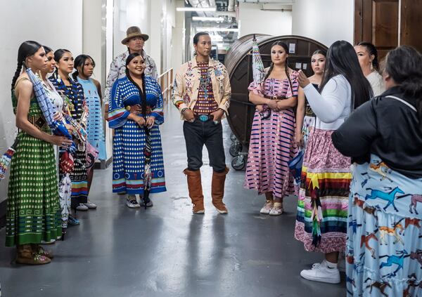 Models prepare to take the runway for the 2025 Native Fashion Show, Friday, May 9, 2025, in Santa Fe, N.M. (AP Photo/Roberto E. Rosales)