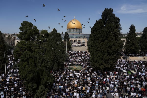 Palestinians perform Friday prayers at the Al-Aqsa Mosque compound in the Old City of Jerusalem, during the holy Muslim month of Ramadan, Friday, March 14, 2025. (AP Photo/Mahmoud Illean)