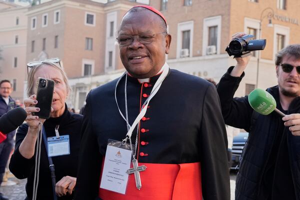 FILE - Cardinal Fridolin Ambongo Besungu arrives for a college of cardinals' meeting, at the Vatican, Wednesday, April 30, 2025. (AP Photo/Gregorio Borgia, File)