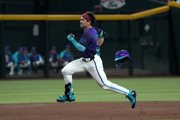 Arizona Diamondbacks' Corbin Carroll runs after hitting a triple against the Los Angeles Dodgers in the third inning during a baseball game, Saturday, May 10, 2025, in Phoenix. (AP Photo/Rick Scuteri)