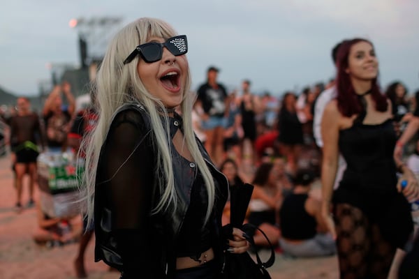A fan waits for the start of Lady Gaga's free concert on Copacabana beach in Rio de Janeiro, Saturday, May 3, 2025. (AP Photo/Bruna Prado)