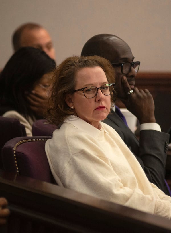 Former Brunswick Judicial Circuit Jackie Johnson sits with her defense team as court opens Thursday, Jan. 30, 2025, in Brunswick, Ga., where she is being tried on charges of violating her oath of office and obstruction of justice in the death of Ahmaud Arbery. (Terry Dickson/The Brunswick News via AP, Pool)