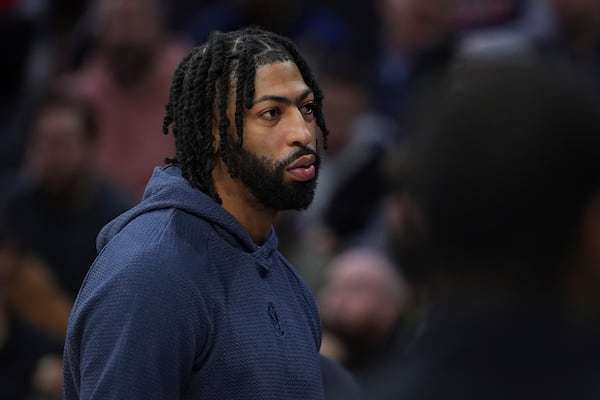 Dallas Mavericks' Anthony Davis walks the floor during a timeout in the first half of an NBA basketball game against the Philadelphia 76ers, Tuesday, Feb. 4, 2025, in Philadelphia. (AP Photo/Matt Slocum)