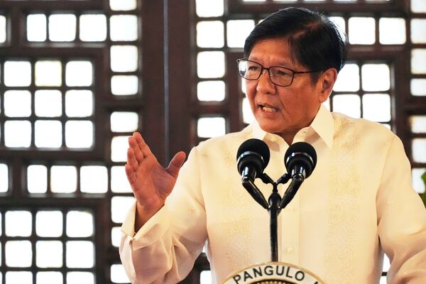 Philippine President Ferdinand Marcos Jr. gestures as he speaks during the presentation of the newly enacted laws to stakeholders at the Malacanang Presidential Palace in Manila, Philippines Thursday, May 22, 2025. (AP Photo/Aaron Favila)