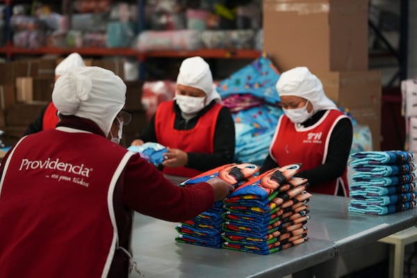 Employees work at a textile factory in Tlaxcala, Mexico, Tuesday, Feb. 4, 2025. (AP Photo/Eduardo Verdugo)