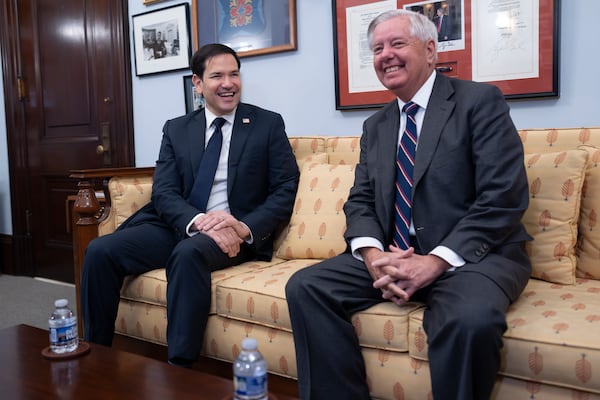 Sen. Marco Rubio, R-Fla., left, President-elect Trump's nominee to be secretary of State, is complimented by Sen. Lindsey Graham, R-S.C., the ranking member on the Senate Judiciary Committee, as they meet at the Capitol in Washington, Tuesday, Dec. 3, 2024. (AP Photo/J. Scott Applewhite)