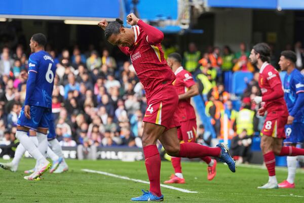 Liverpool's Virgil van Dijk celebrates scoring his side's first goal during the English Premier League soccer match between Chelsea and Liverpool at Stamford Bridge stadium in London, Sunday, May 4, 2025. (AP Photo/Kin Cheung)