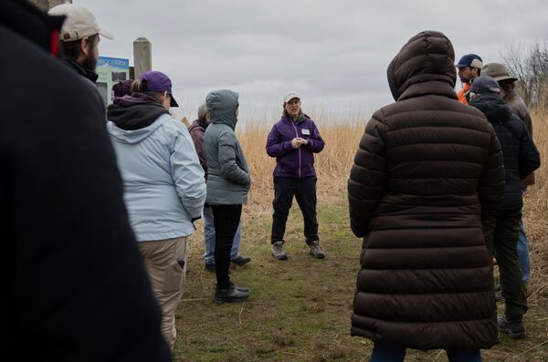 Lorna Wright, the executive director of the Genesee Land Trust, talks to new members at Cornwall Preserve, Saturday, March 22, 2025, in Pultneyville, N.Y. (AP Photo/Maryel Pryce)