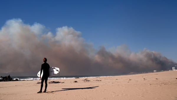 Smoke from a wildfire is seen from the Venice Beach section of Los Angeles, Tuesday, Jan. 7, 2025. (AP Photo/Jae C. Hong)