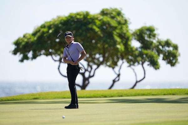 Kensei Hirata, of Japan, watches his shot on the 16th green during the second round of the Sony Open golf event, Friday, Jan. 10, 2025, at Waialae Country Club in Honolulu. (AP Photo/Matt York)