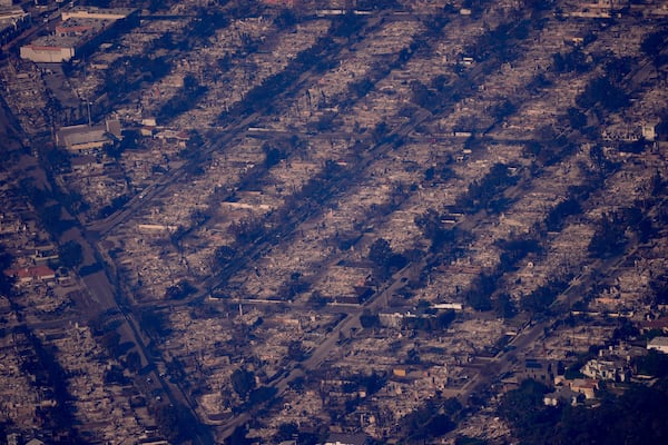 The devastation from the Palisades Fire is seen from the air in the Pacific Palisades neighborhood of Los Angeles, Thursday, Jan. 9, 2025. (AP Photo/Mark J. Terrill)