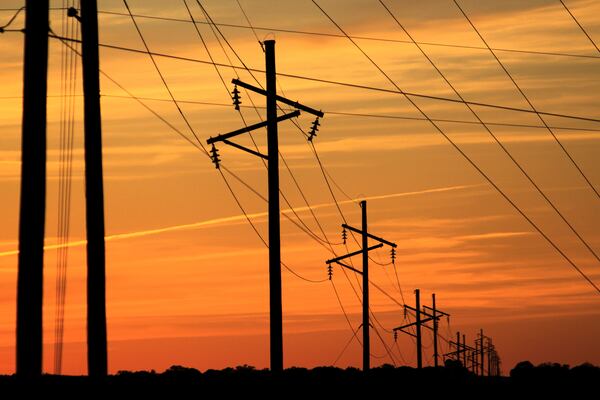 Intersecting transmission lines are pictured near Show Low, Ariz., Tuesday, April 22, 2025. (AP Photo/Susan Montoya Bryan)